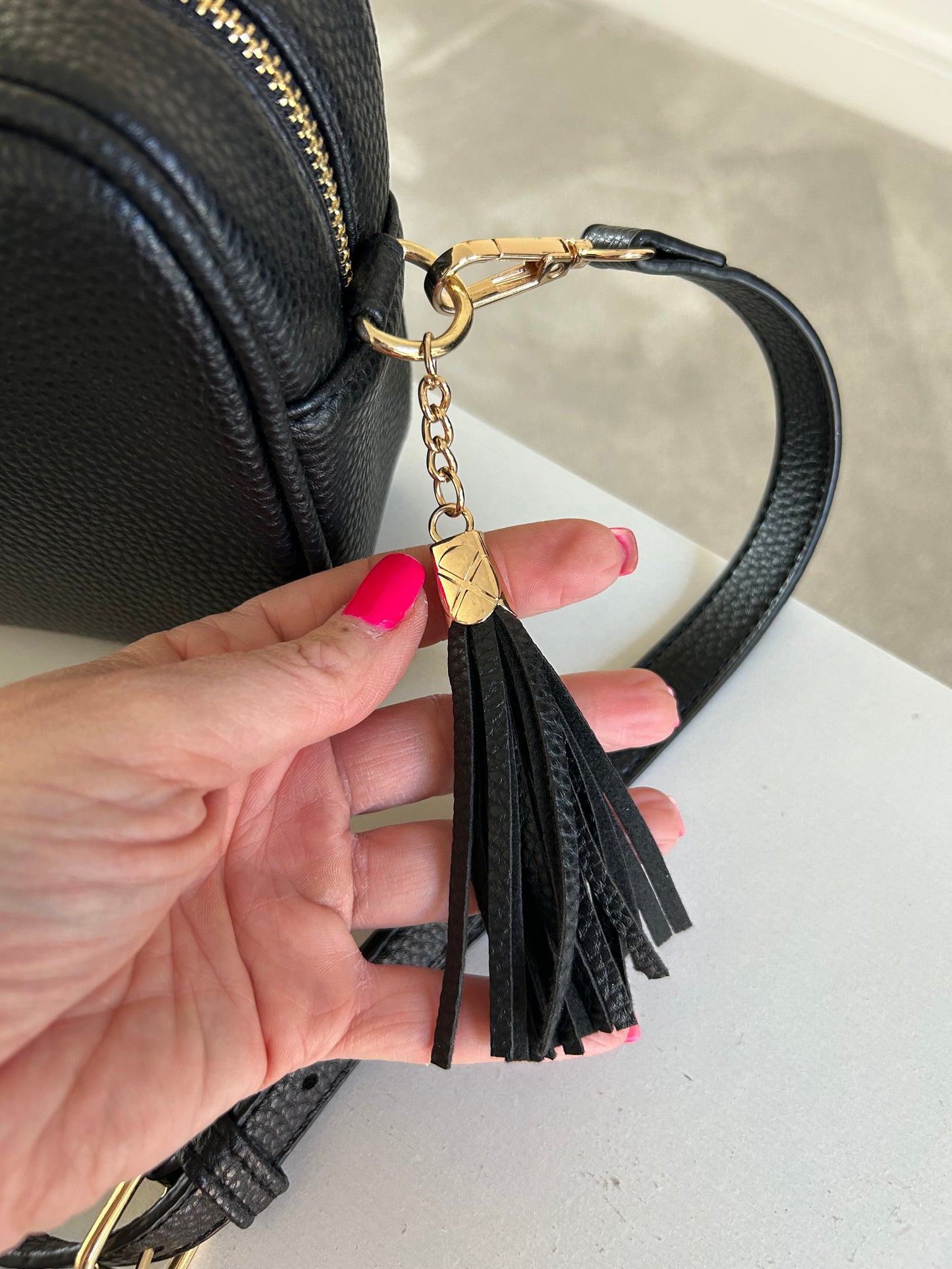 Carly - Small crossbody bag with tassel - Black